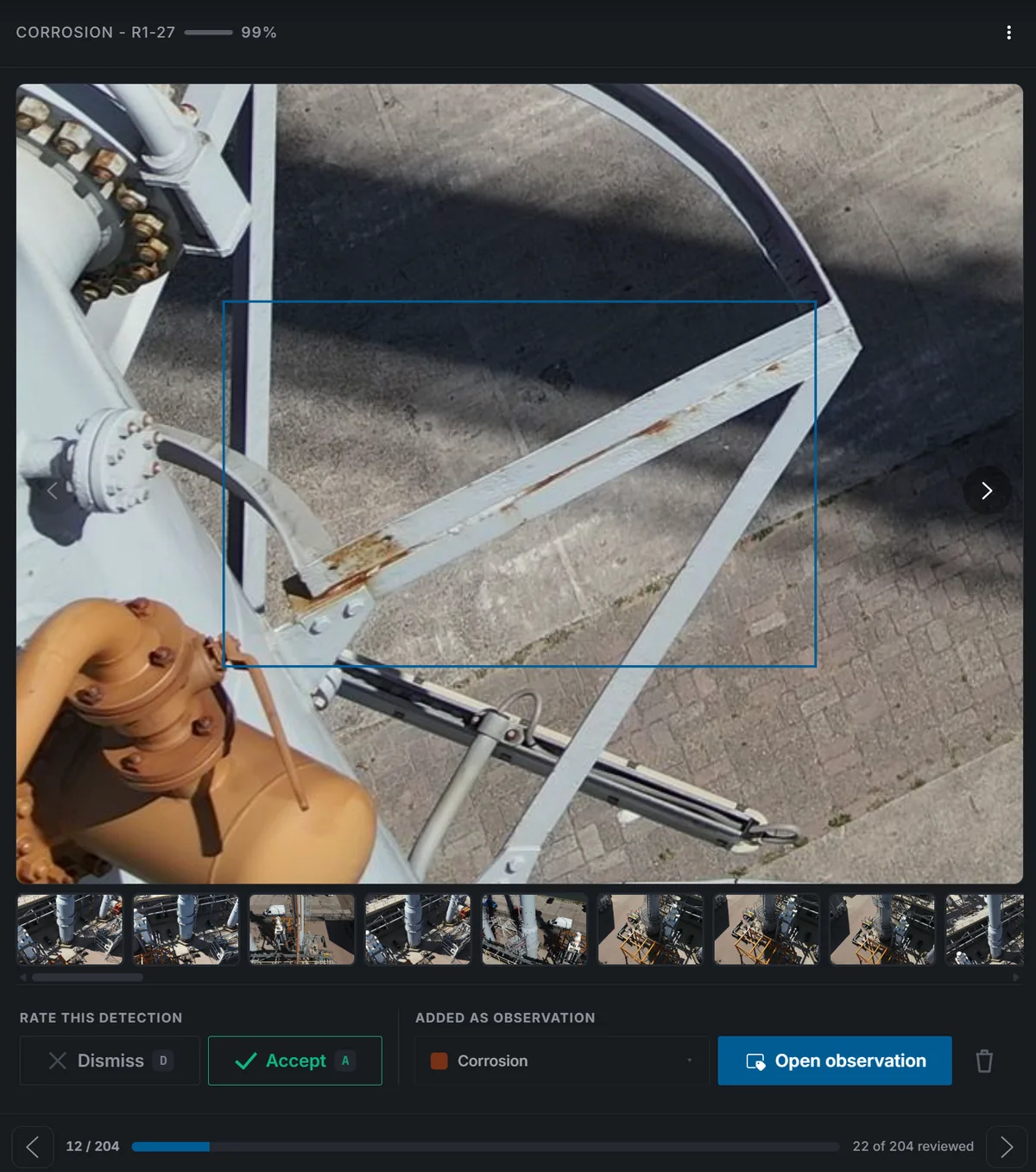 Twinsity AI review screen showing a corrosion detection at 99 percent confidence on a steel structure, with accept and dismiss controls and the detection added as an observation